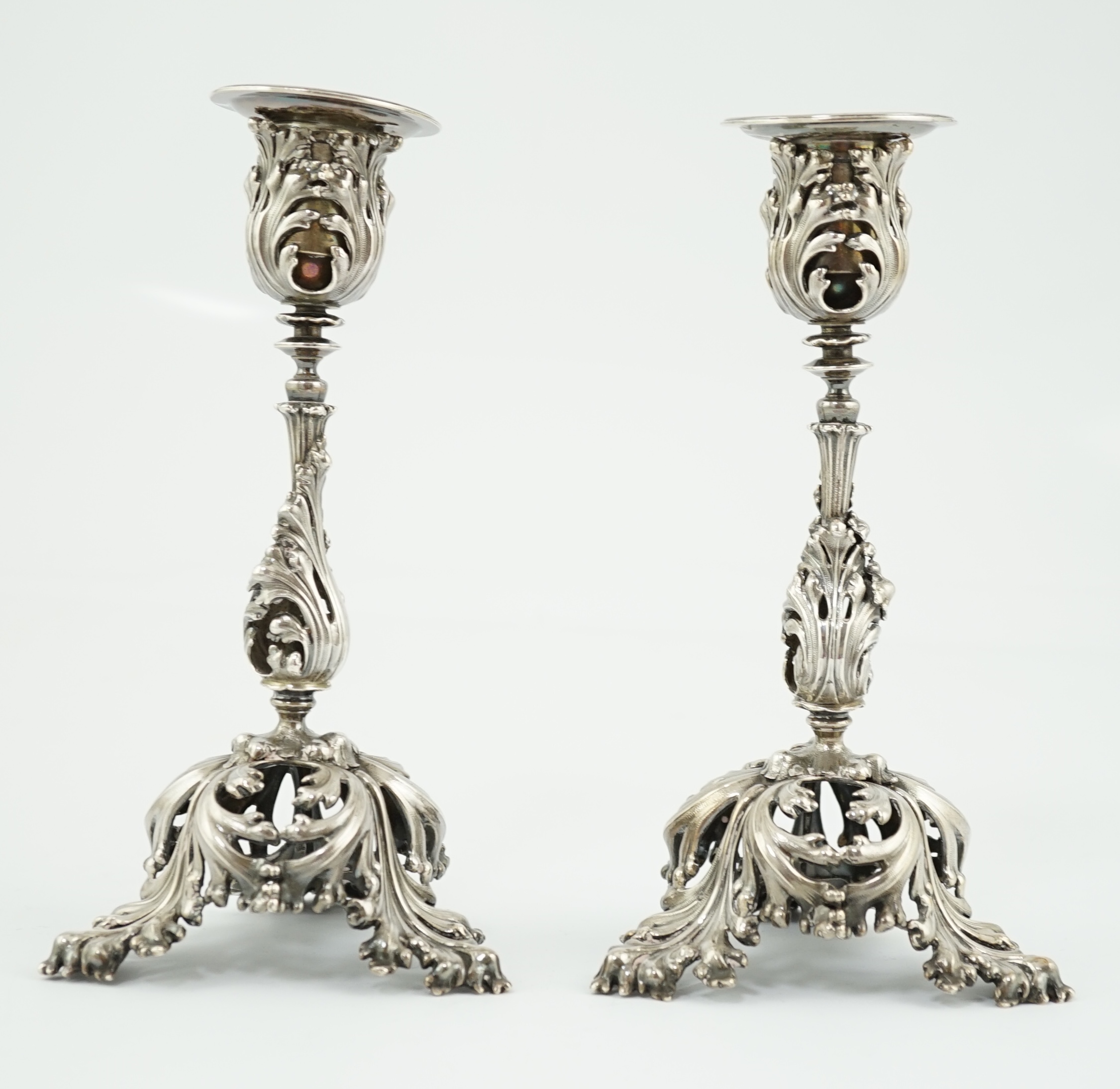 A pair of French pierced 950 standard silver candlesticks